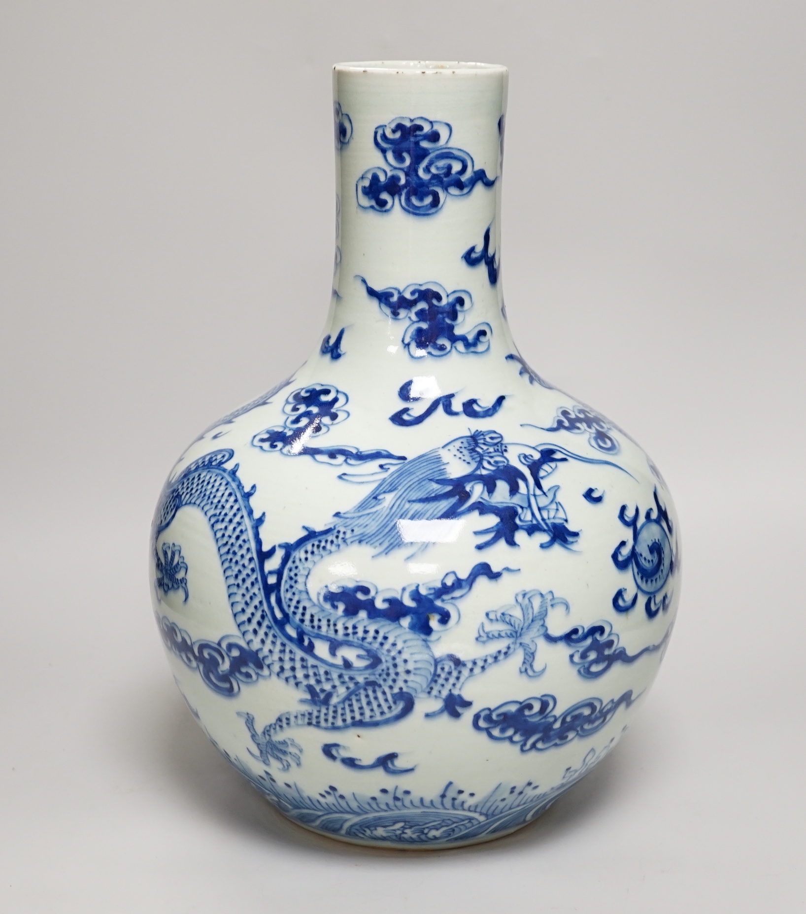 A Chinese blue and white ‘Dragon’ vase, tianqiuping, Qianlong mark but 19th century, 34cm